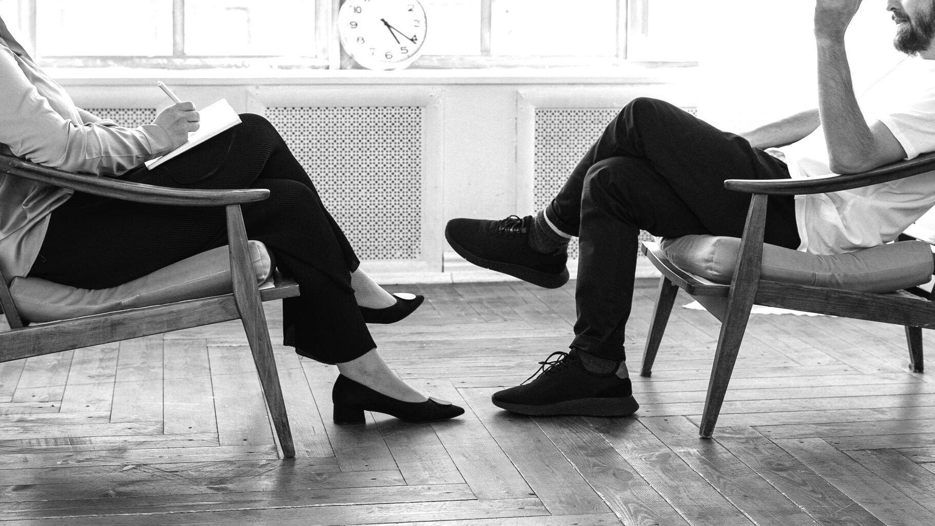 Counselling session A counselling session with two people sitting and talking